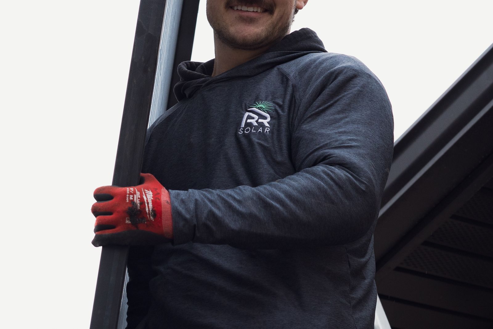 An R&R Solar Roofs technician on-site at a Utah home